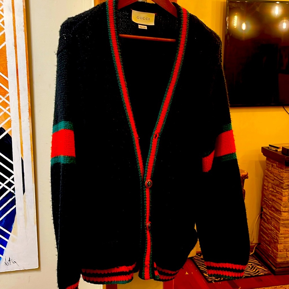 warm cardigan sweater . Sold as is .Missing top button . Great style /comfort